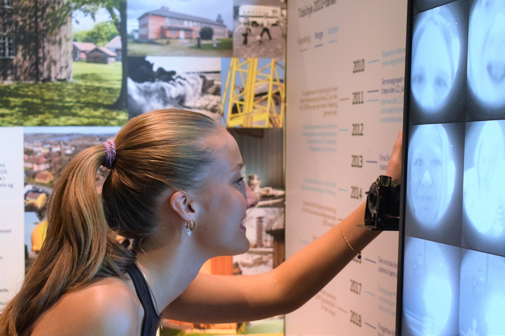 Visitors interact with photo booth installation